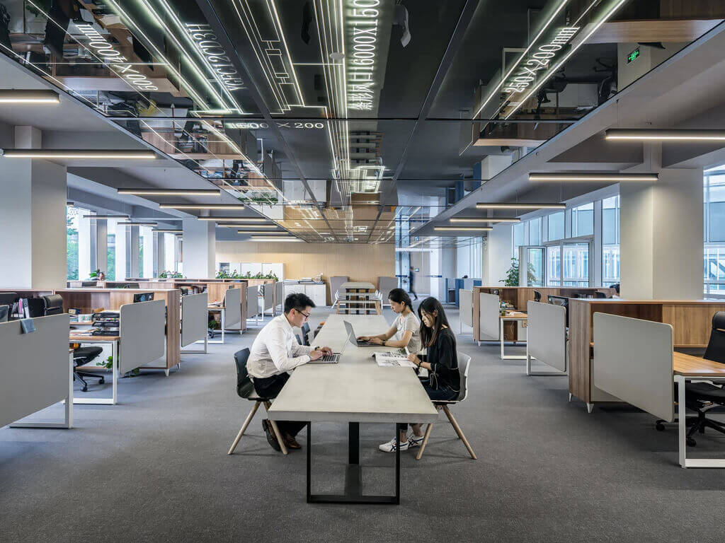 image of three people working